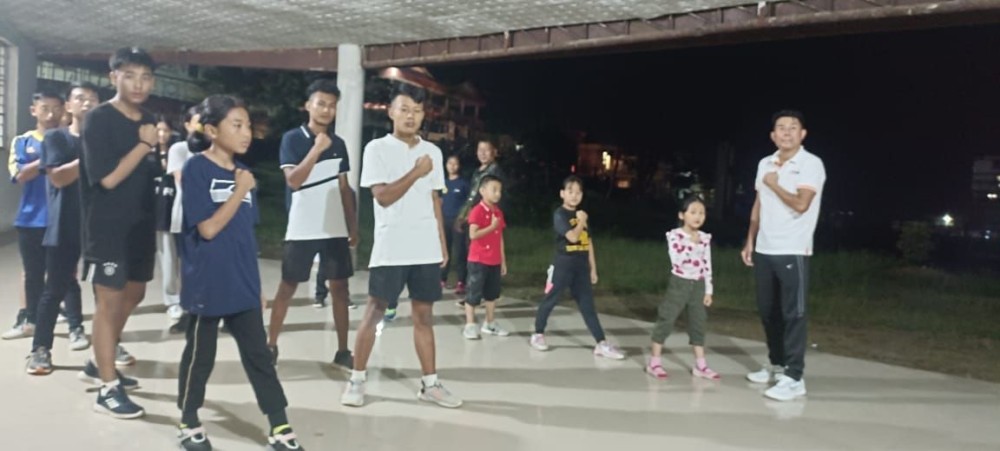 DYRS Boxing Coach and NABA Vice President,  Lakatsu Chophy, (extreme right) trains  young pugilists of Mokokchung on the first day of the 2nd Free Boxing Coaching Camp at P Shilu Ao Park, Imkongmeren Sports complex on October, 10. (Photo Courtesy: BAM)